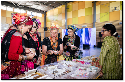 A group of women in traditional dress

Description automatically generated with low confidence