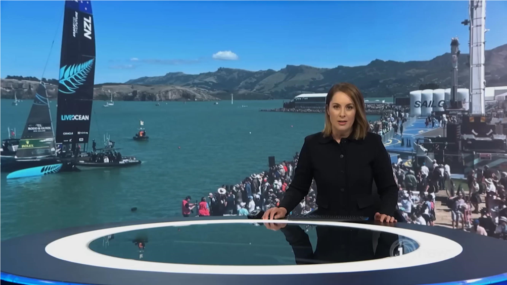 A person standing on a desk in front of a large body of water

Description automatically generated with medium confidence
