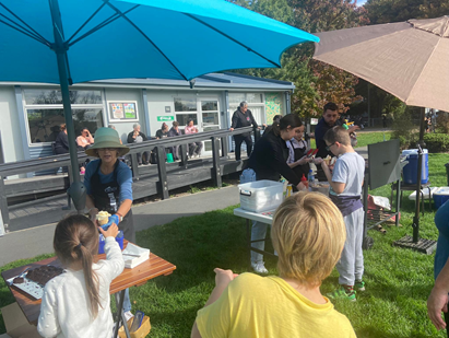 A group of people outside
Description automatically generated