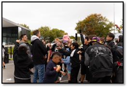 A group of people standing in a circle

Description automatically generated with medium confidence
