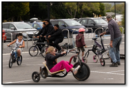 A group of people riding bicycles

Description automatically generated