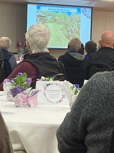 A group of people sitting at a table

Description automatically generated