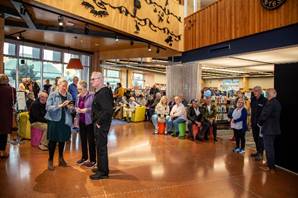 A group of people in a room

Description automatically generated