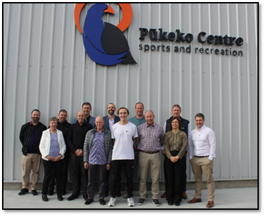 A group of people posing for a photo

Description automatically generated