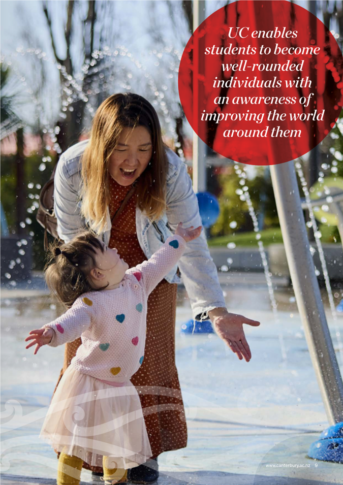 A person and a child playing in a water fountain

Description automatically generated with medium confidence