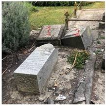 A group of stone blocks with writing on them

Description automatically generated