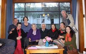 A group of people posing for a photo

Description automatically generated