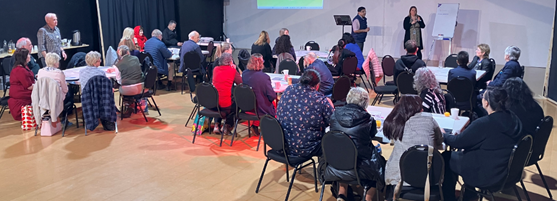 A group of people sitting in chairs

Description automatically generated