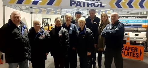 Hornby community patrols photographed in front of community patrol sign. 