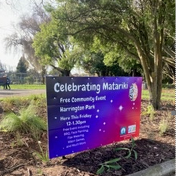 A sign in a park

Description automatically generated
