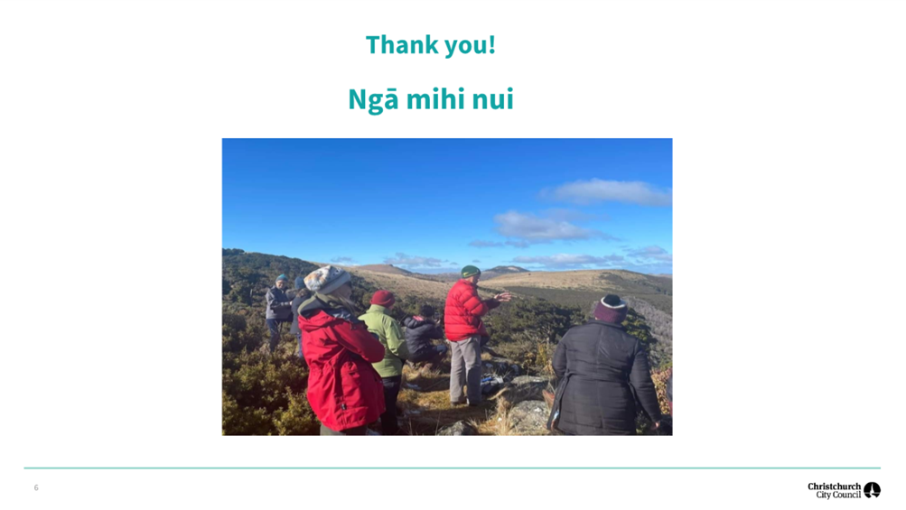 A group of people standing on a rock

Description automatically generated