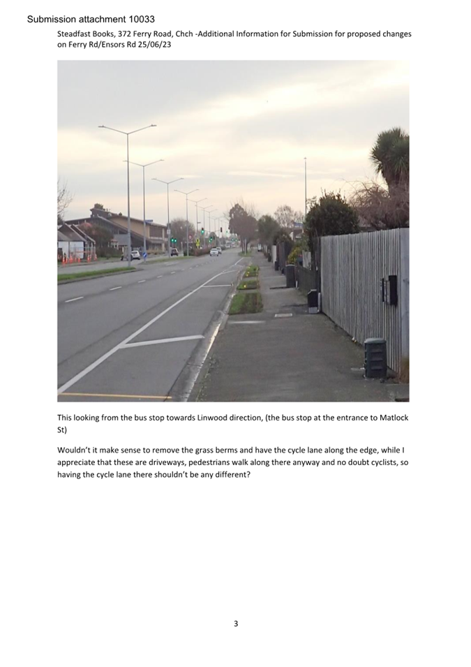 A road with a fence and street lights

Description automatically generated