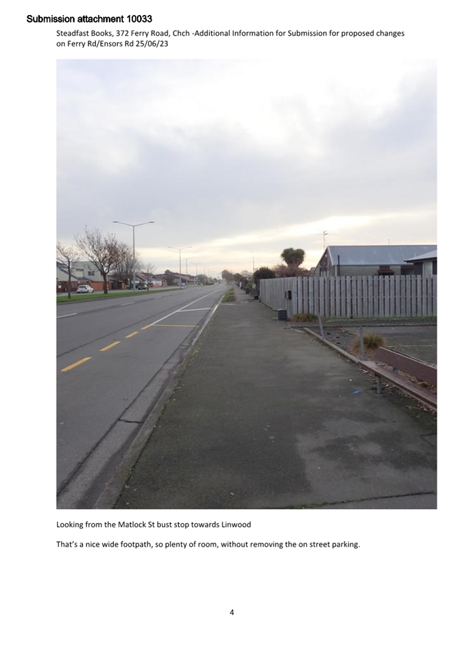 A road with a fence and a fence

Description automatically generated