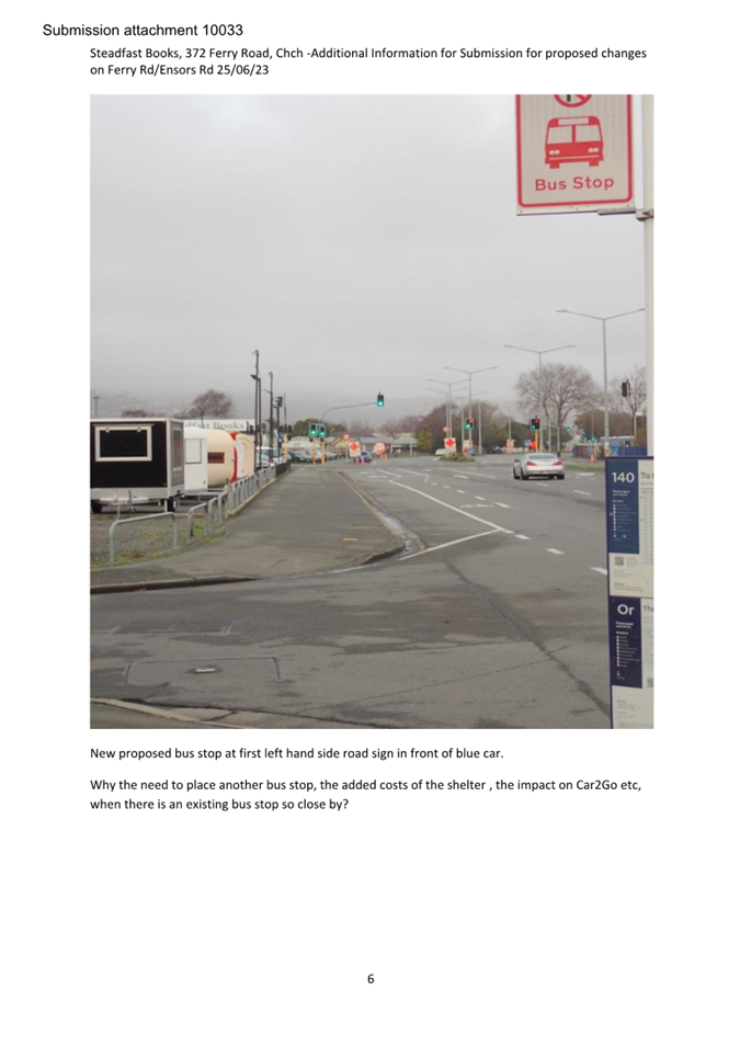 A bus stop sign on a street

Description automatically generated