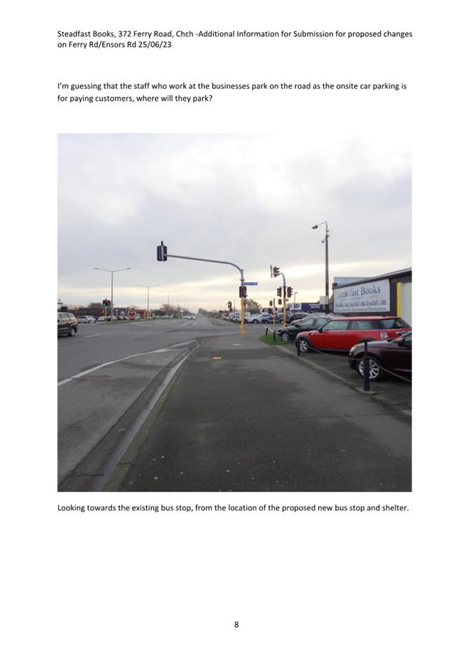 A street with cars parked on the side

Description automatically generated