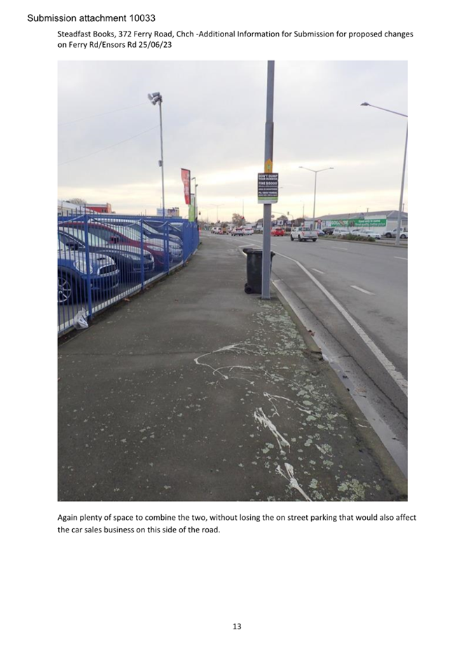 A street with a sign on it

Description automatically generated