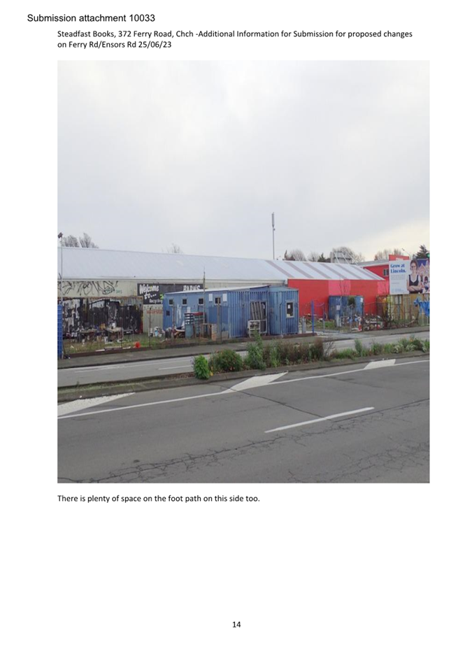 A red and blue building next to a road

Description automatically generated