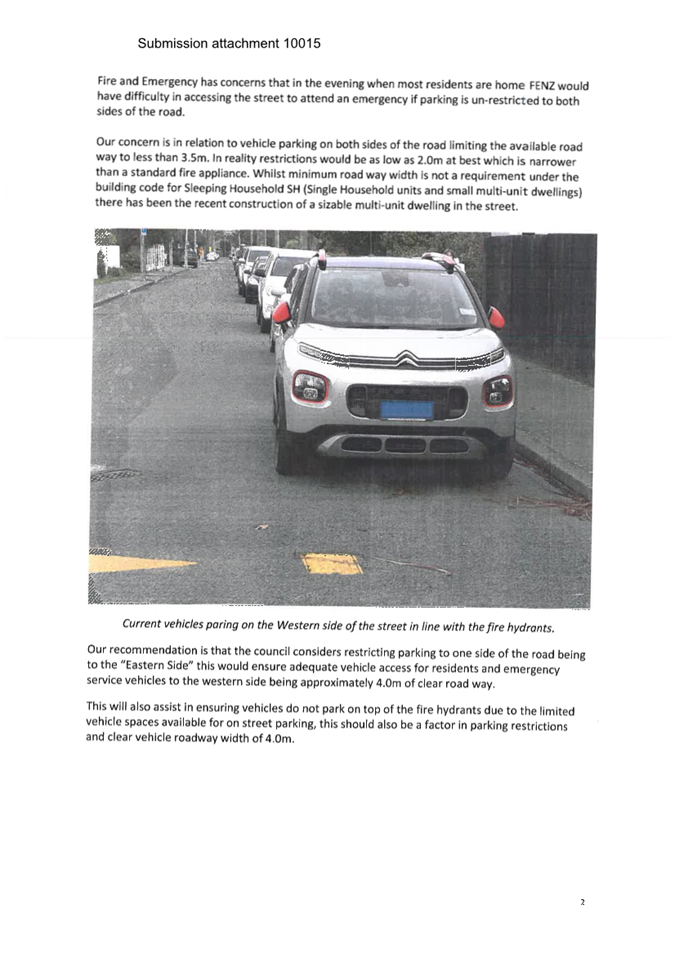 A group of cars parked on a street

Description automatically generated