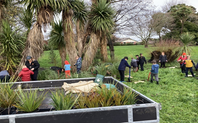 A group of people in a park

Description automatically generated