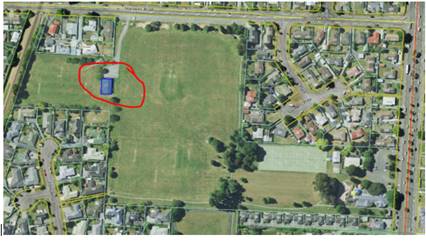 Aerial view of a large green field

Description automatically generated