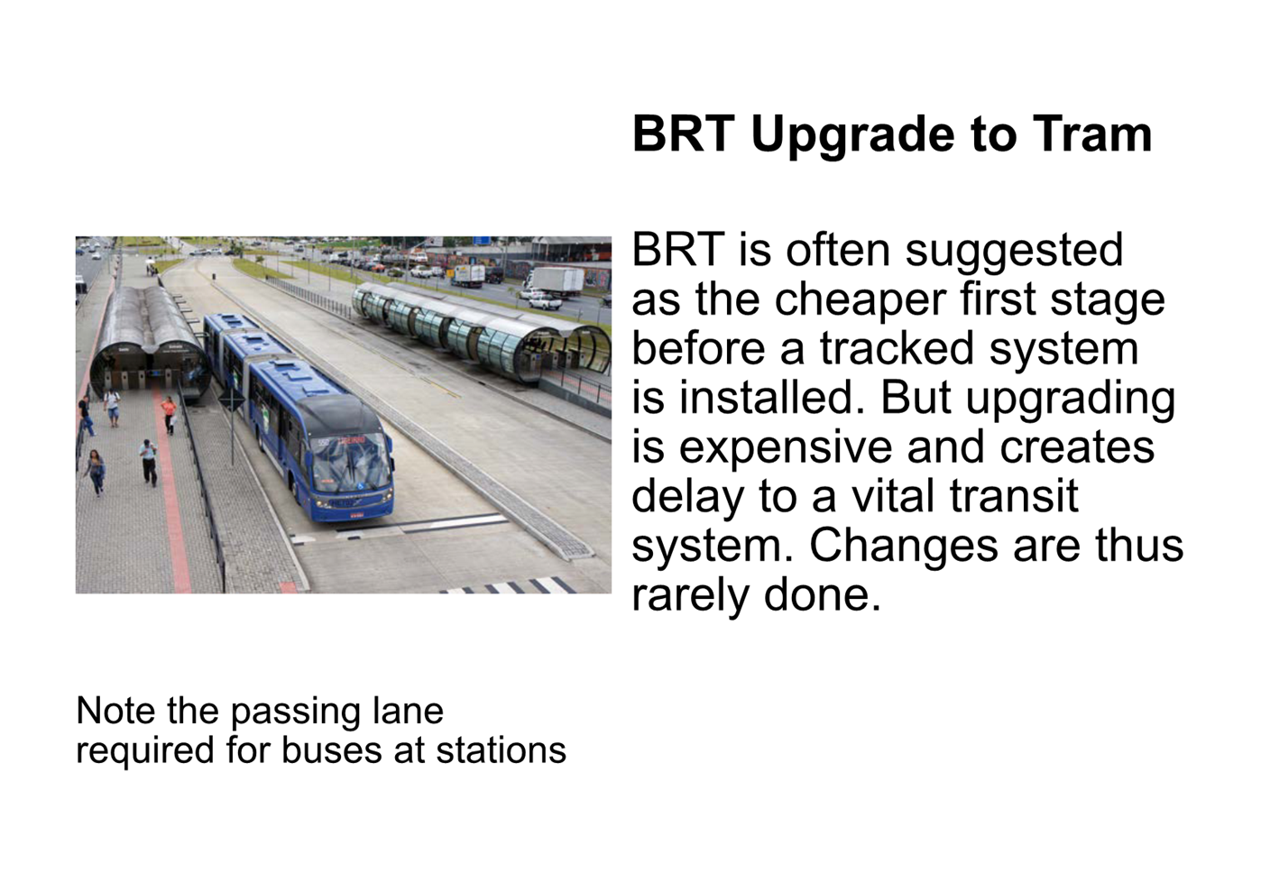 A blue train on a track

Description automatically generated with medium confidence