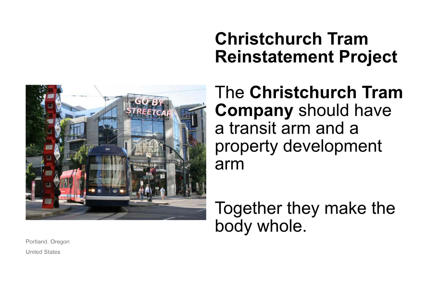 A red train on a street

Description automatically generated with medium confidence