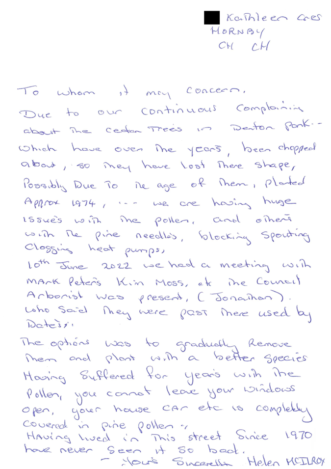 A handwritten letter on a piece of paper

Description automatically generated