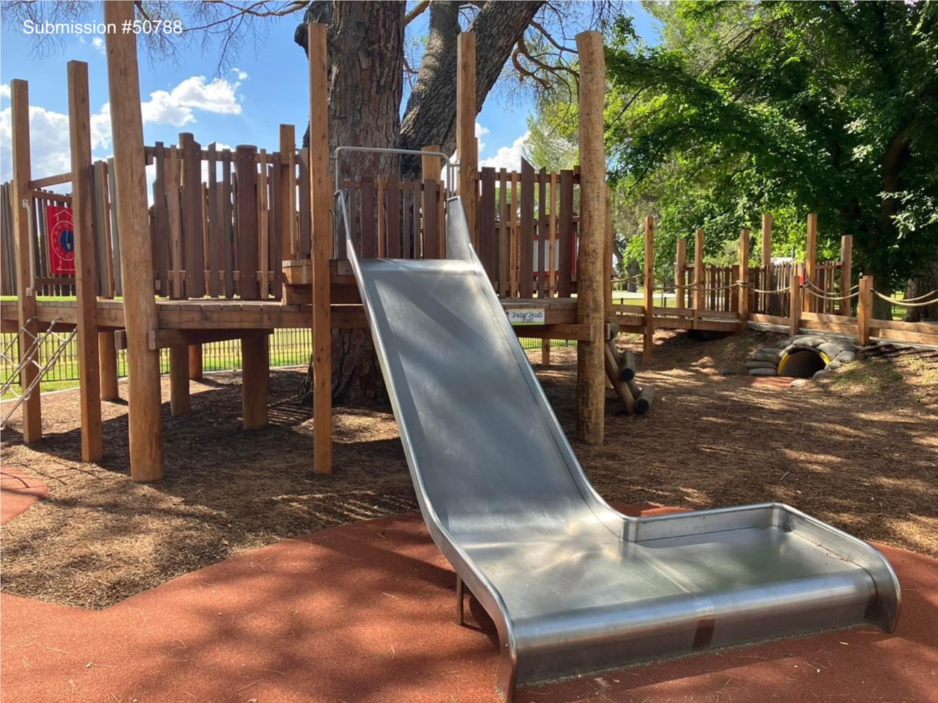 A slide in a playground

Description automatically generated