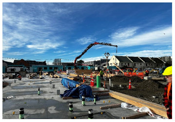 Construction site with construction equipment and blue sky

Description automatically generated