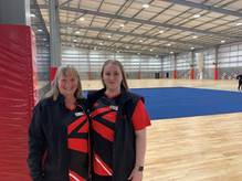 Two Christchurch Netball Centre open day volunteers posing for a photo in the facility.