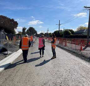 Community Board members standing on Halswell Junction Road
