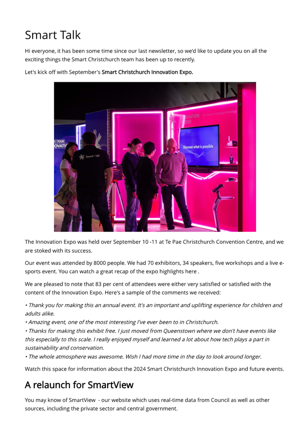 A group of people standing in front of a screen

Description automatically generated