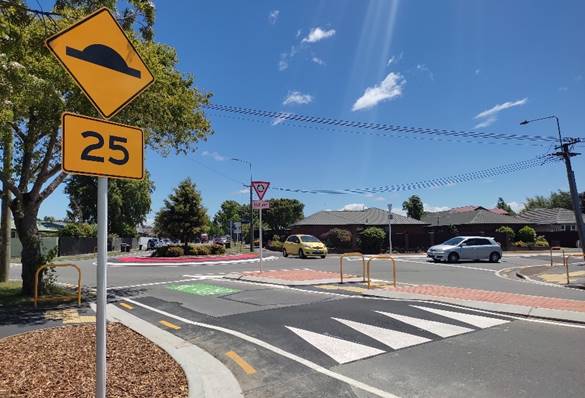 A road sign on a street

Description automatically generated
