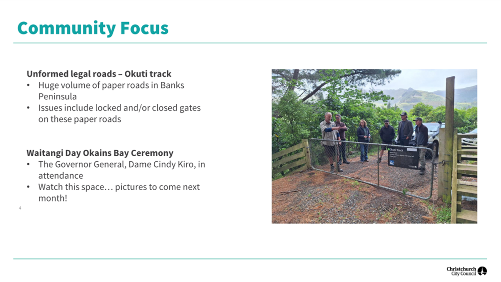 A group of people standing in front of a fence

Description automatically generated