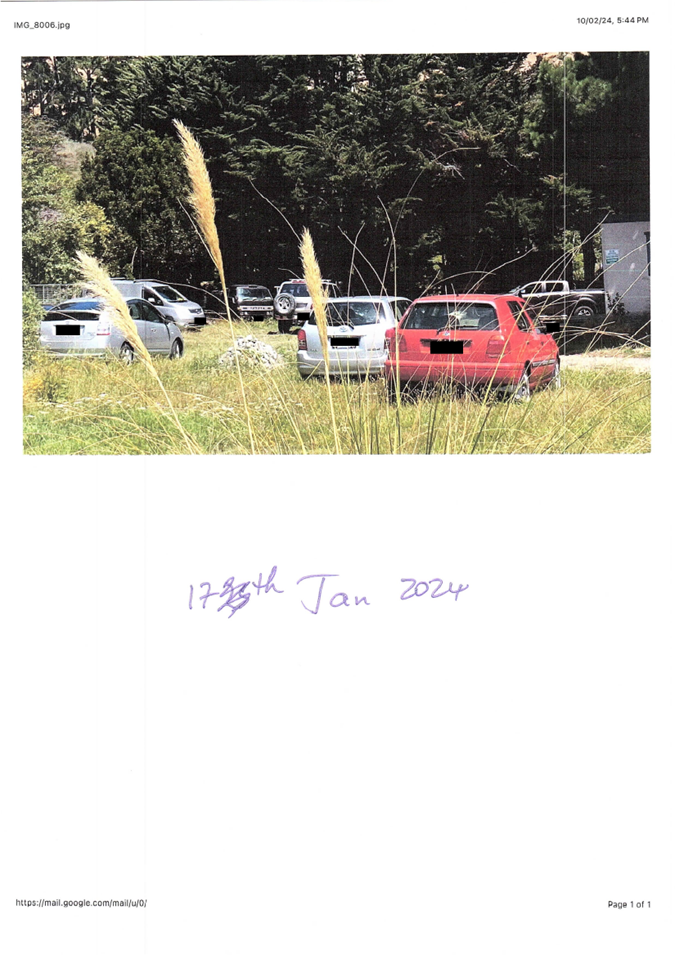 A car parked in a field

Description automatically generated