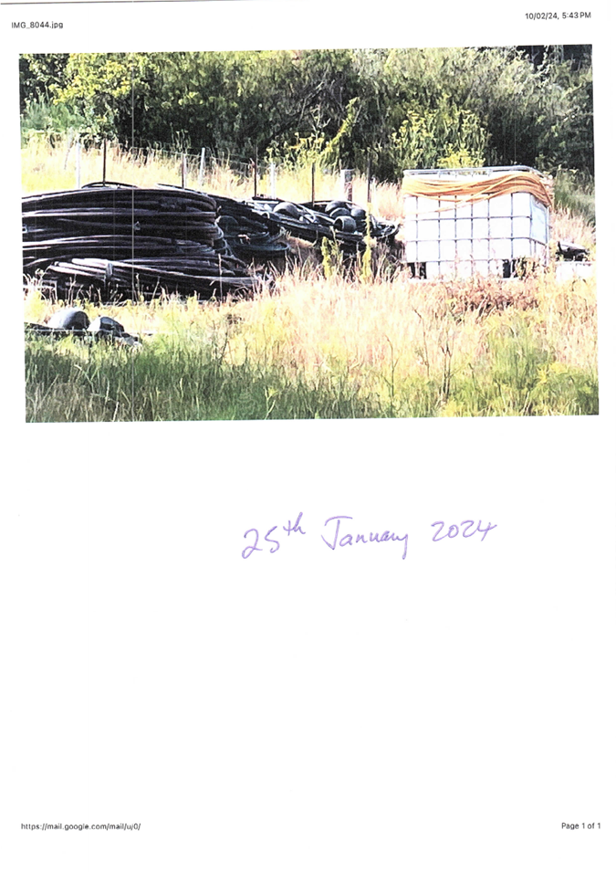 A white box with black tubes in a field

Description automatically generated with medium confidence