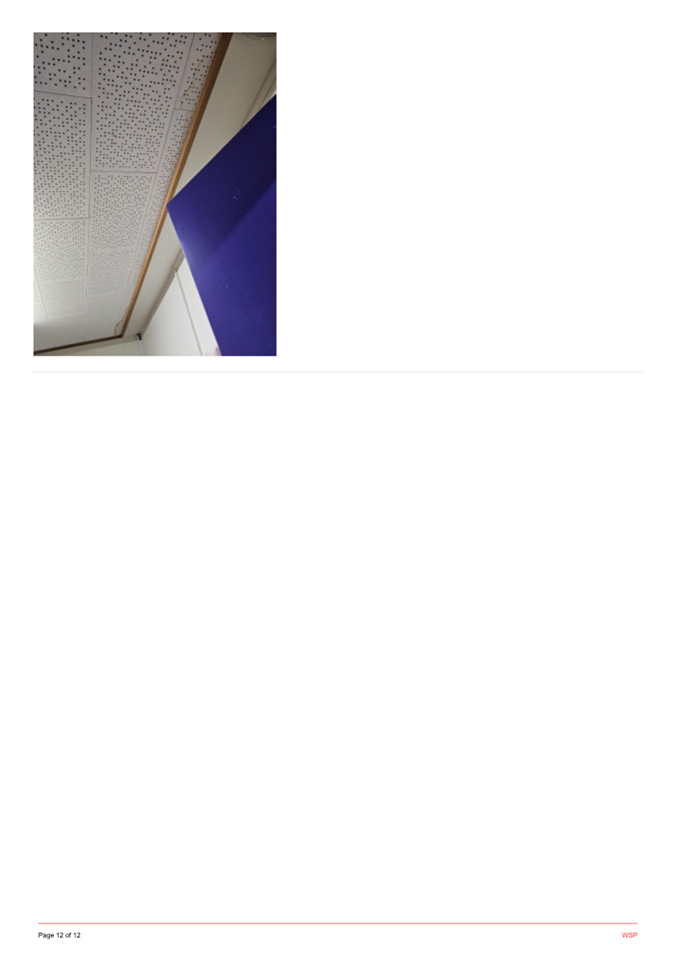 A white wall with a blue ceiling

Description automatically generated