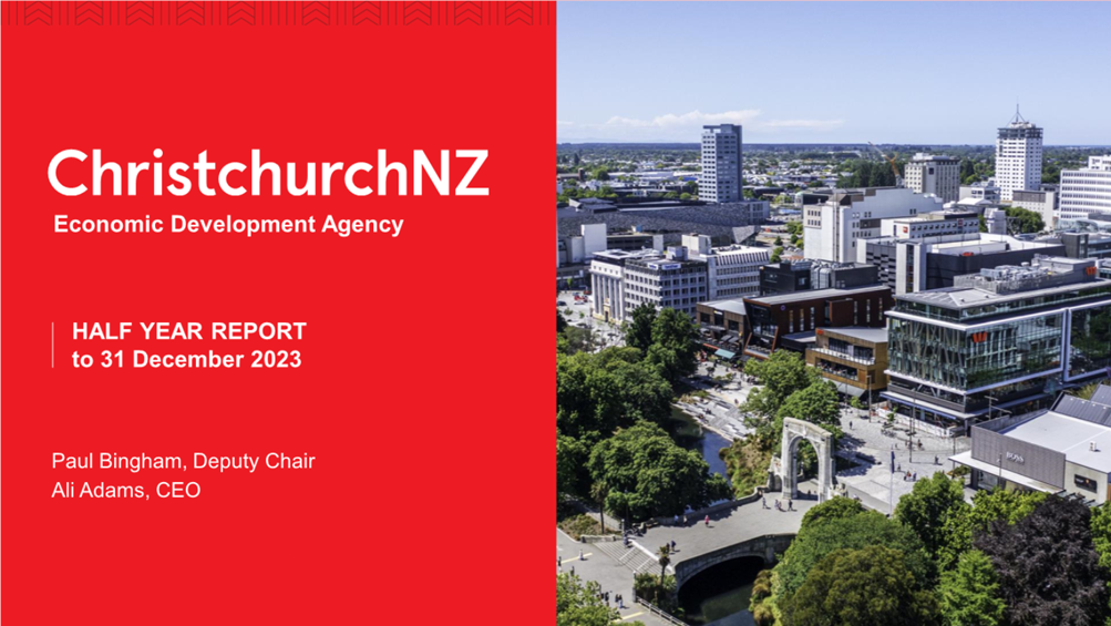 A red cover with a red square with buildings and a bridge

Description automatically generated