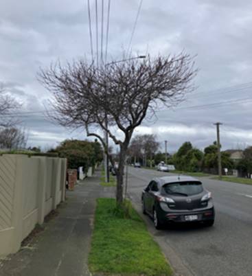 A car parked on the side of a road

Description automatically generated