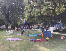 A group of people in a park

Description automatically generated