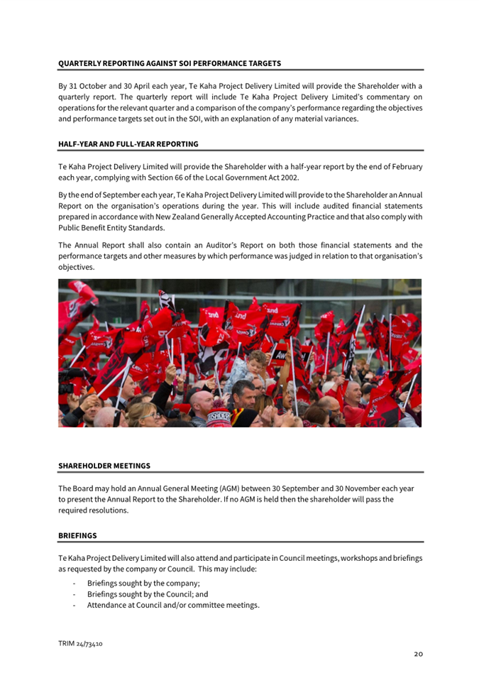 A group of people holding flags

Description automatically generated