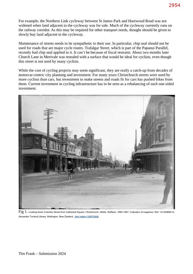 A black and white photo of a street

Description automatically generated