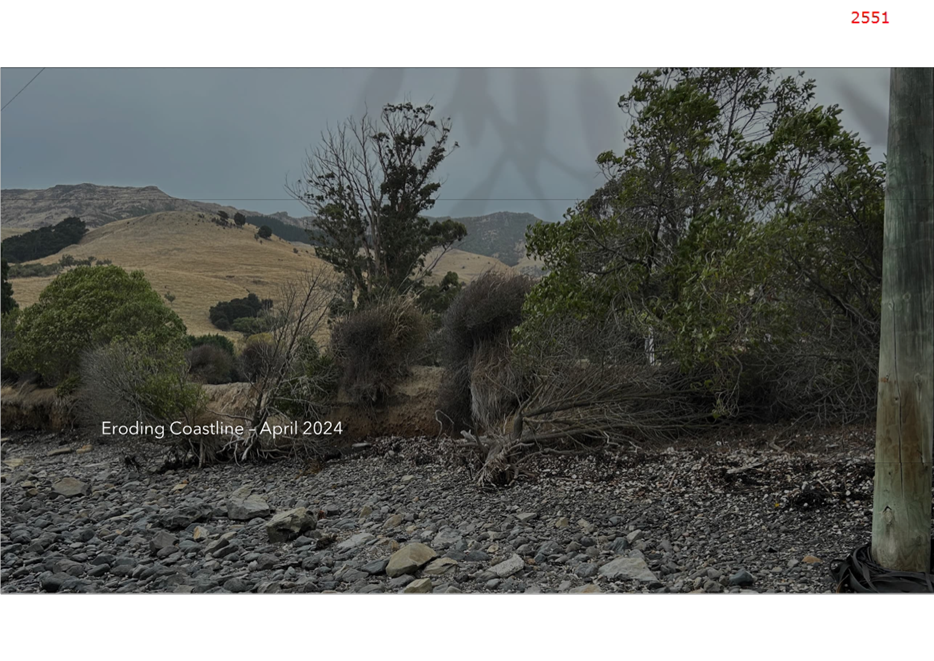 A rocky landscape with trees and hills

Description automatically generated
