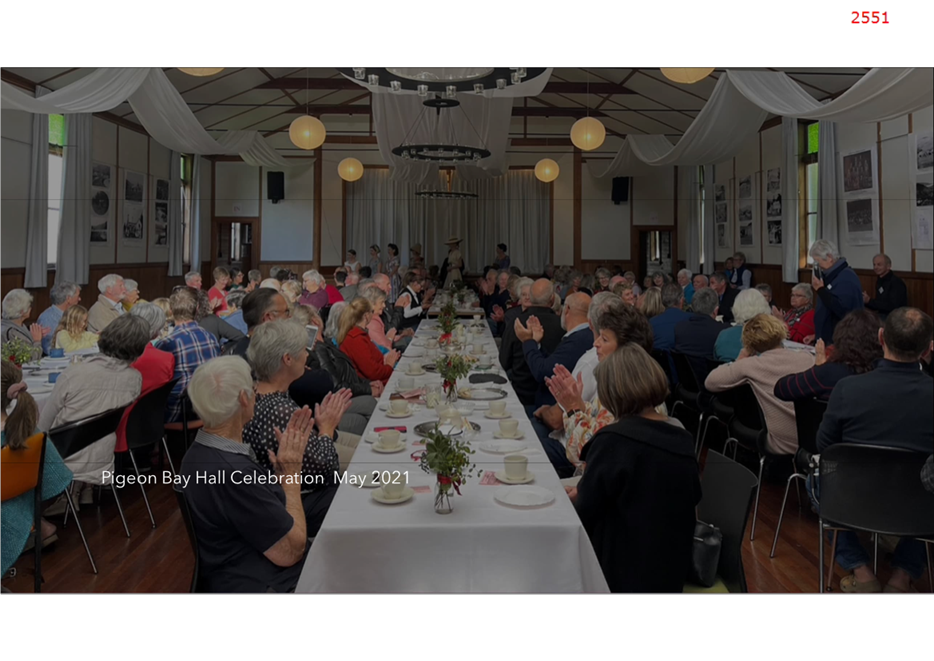 A group of people sitting at a long table

Description automatically generated