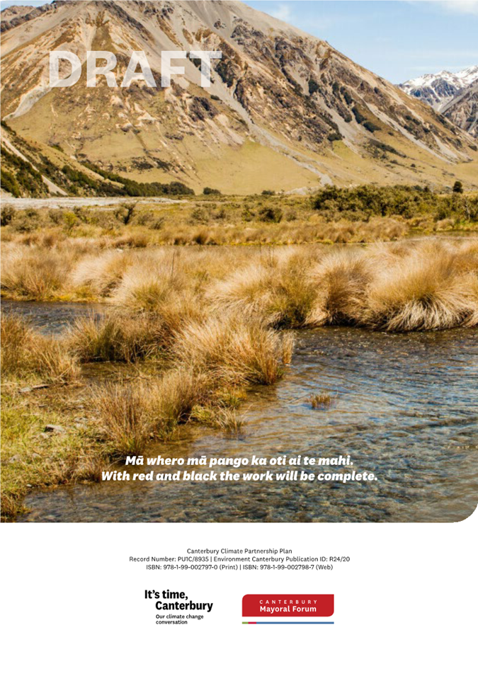 A river with grass and mountains in the background

Description automatically generated