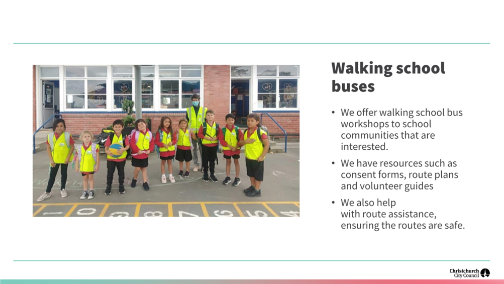 A group of people standing in a parking lot

Description automatically generated