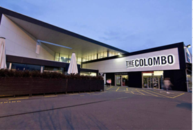 A building with a sign on the front

Description automatically generated