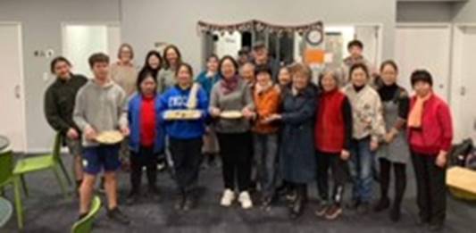 A group of people posing for a photo

Description automatically generated