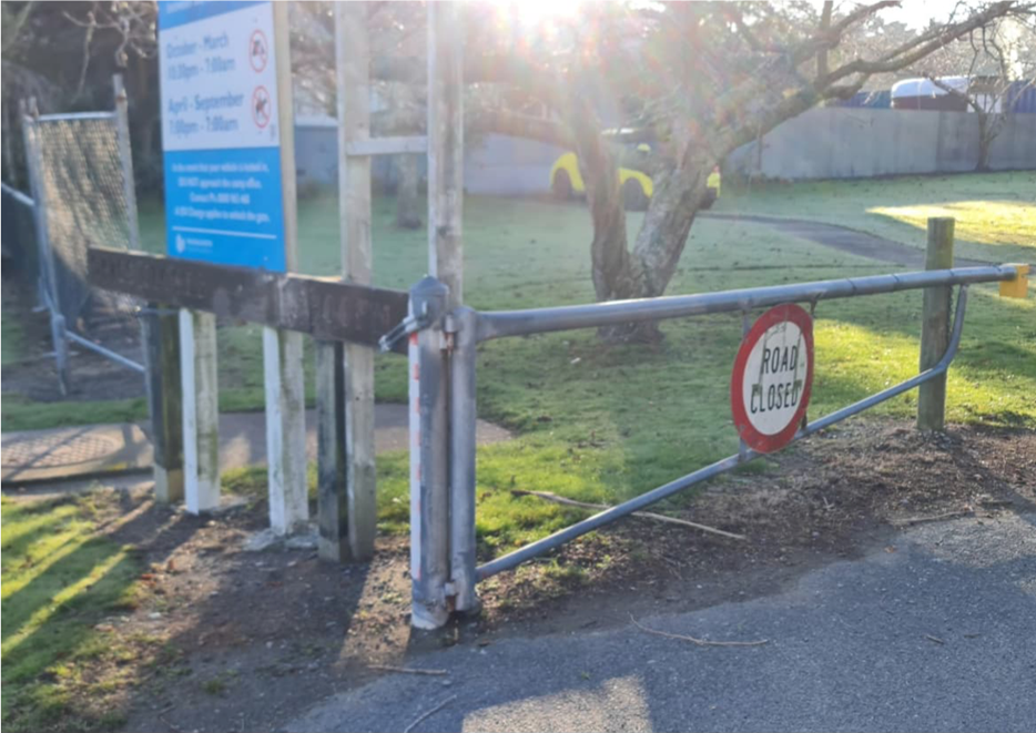 A sign on a metal gate

Description automatically generated
