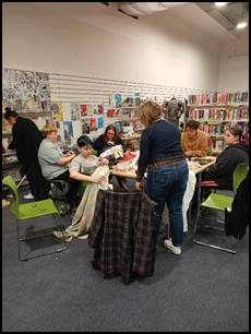 A group of people in a room

Description automatically generated
